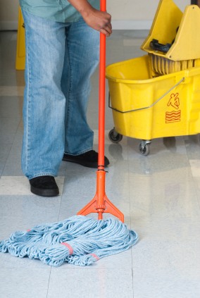 Sparkle and Shine Commercial Services janitor in Frogtown, PA mopping floor.